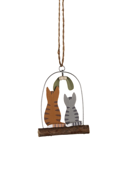 Kitties under mistletoe decoration