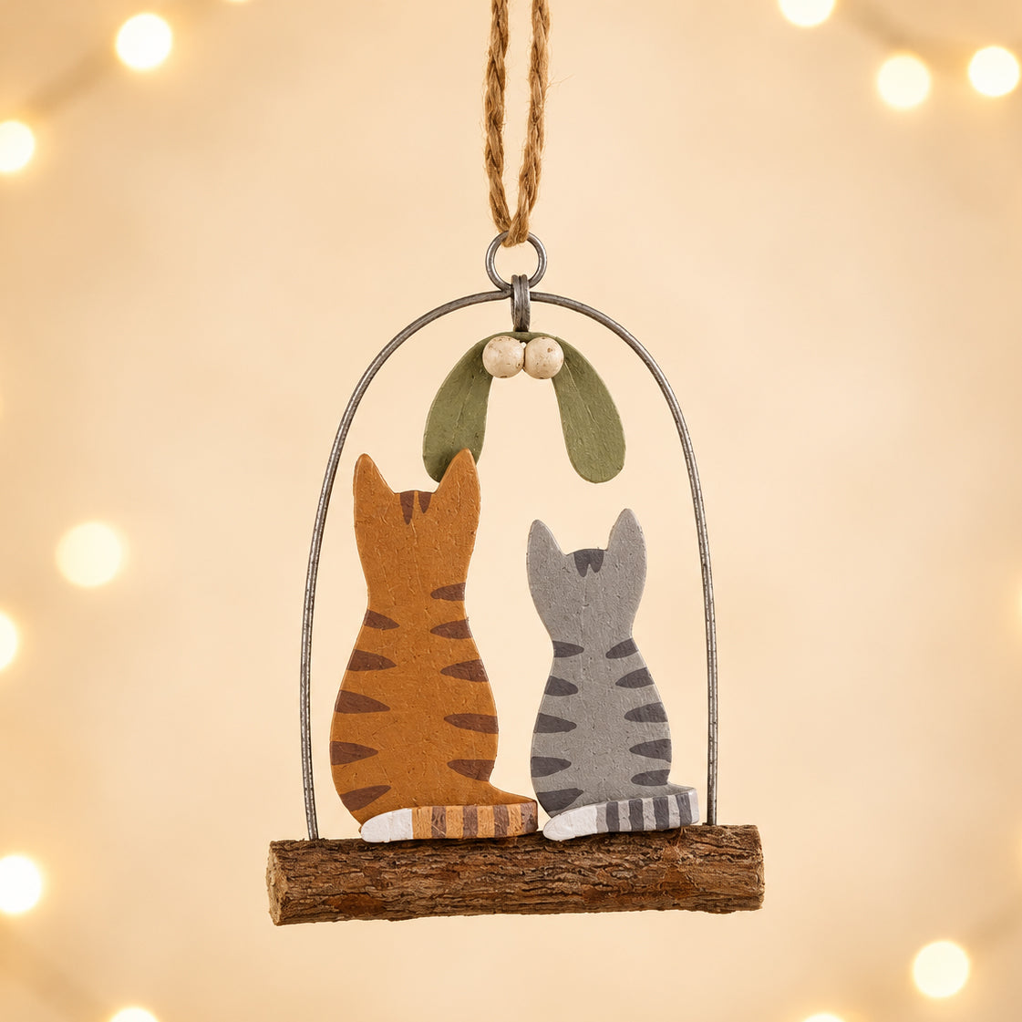 Kitties under mistletoe decoration